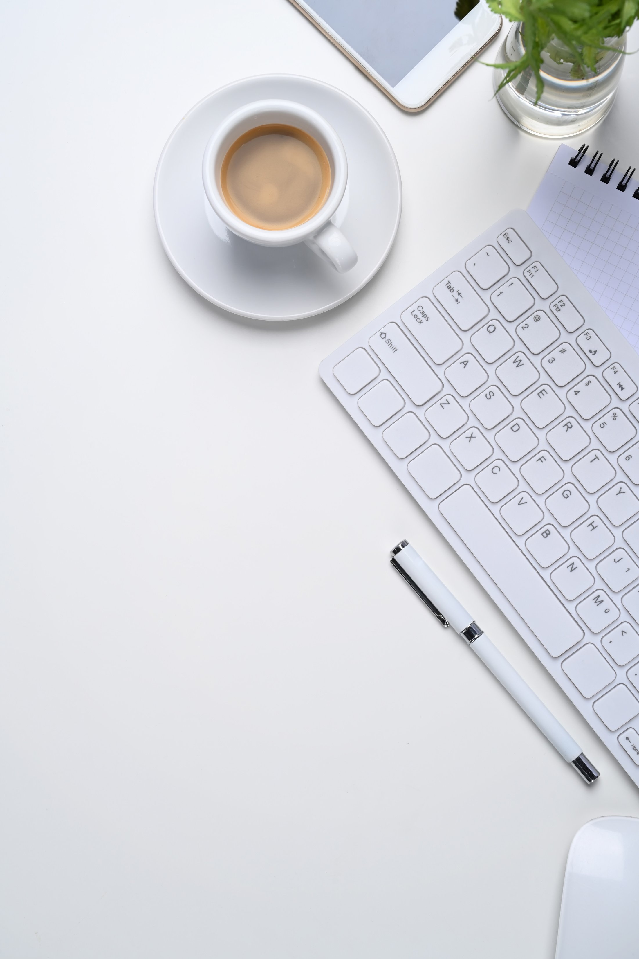 Minimal Workplace with Wireless Keyboard, Coffee Cup, Mobile Pho